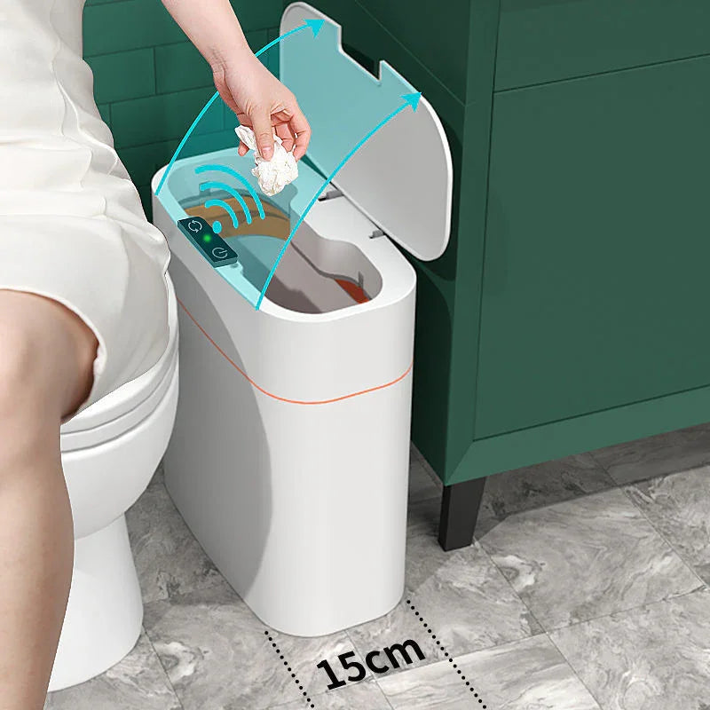 Motion sensor trash can opening automatically in modern bathroom, hand discarding tissue