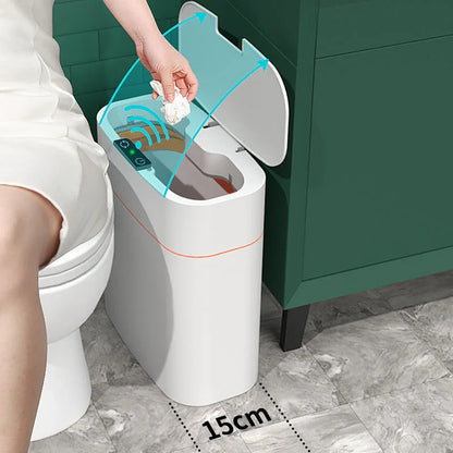 Motion sensor trash can opening automatically in modern bathroom, hand discarding tissue
